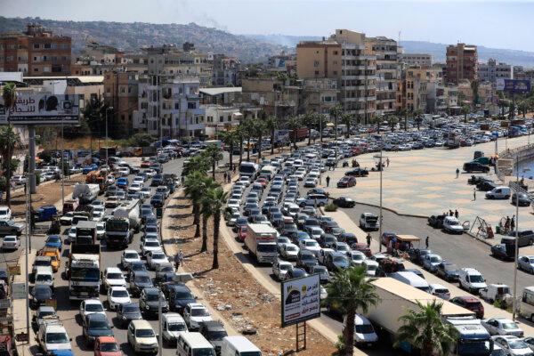 Cars sit in traffic as they flee the southern villages amid Israeli airstrikes, in Sidon, Lebanon, on Sept. 23, 2024. (AP Photo/Mohammed Zaatari)