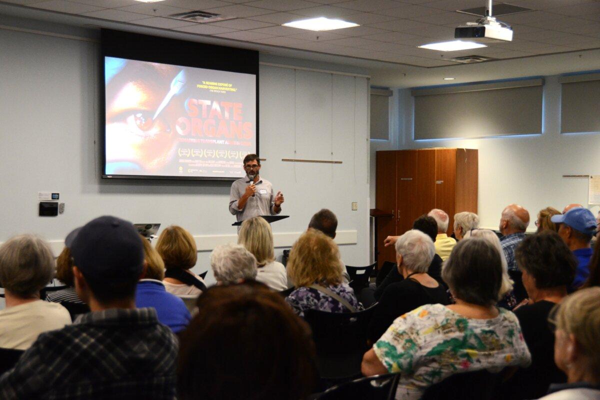 Abraxas Hudson, president of DMFA, gives remarks before the screening of State Organs at Lewes Public Library in Lewes, Del., on Oct. 3, 2024. (Frank Liang/The Epoch Times)