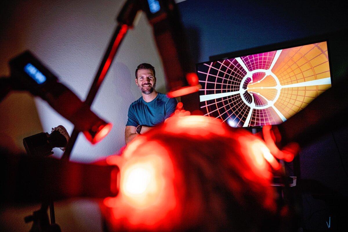 Crawford poses with the equipment he uses for conducting light therapy. (Courtesy of Brandon Crawford)