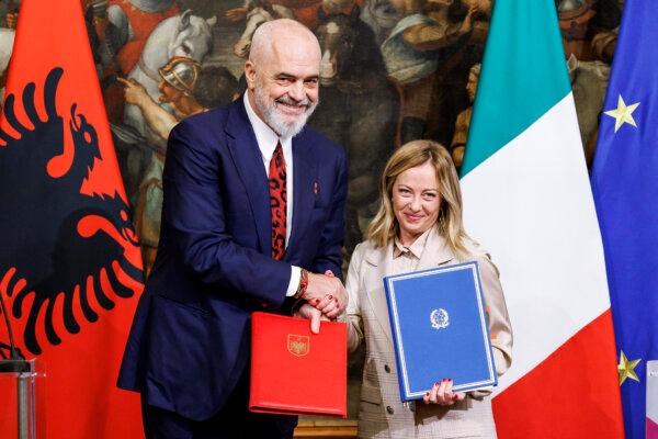 Italian Premier Giorgia Meloni (R) and Albanian Prime Minister Edi Rama (L) shake hands after the signing of a memorandum of understanding on migrant management centers during a meeting in Rome on Nov. 6, 2023. (Roberto Monaldo/LaPresse via AP, File)