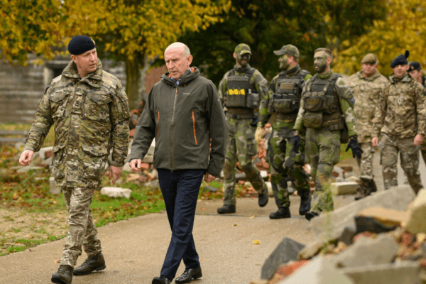 Defence Secretary John Healey with soldiers and staff at the Stanford Training Area to meet with British and Ukrainian troops training there, near Thetford, England, on Oct. 20, 2024. (Leon Neal/PA Wire)