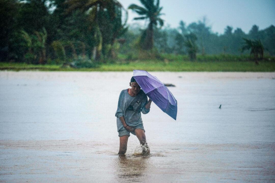 Tropical Storm Battering Philippines Leaves at Least 24 People Dead in Flooding and Landslides