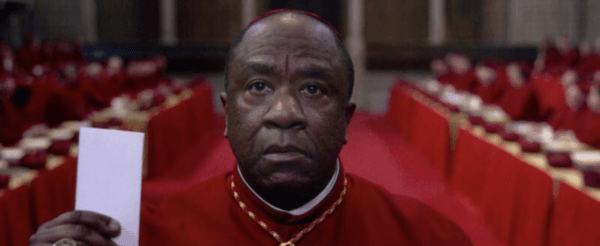 Cardinal Adeyemi (Lucian Msamati) turns in his vote, in "Conclave." (Focus Features)