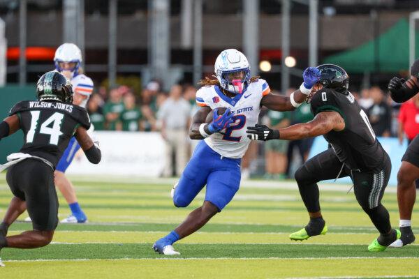 Ashton Jeanty #2 of the Boise State Broncos brushes off Elijah Robinson #0 of the Hawaii Rainbow Warriors during the first half of the game at the Clarence T.C. Ching Athletics Complex in Honolulu, Hawaii, on Oct. 12, 2024. (Darryl Oumi/Getty Images)