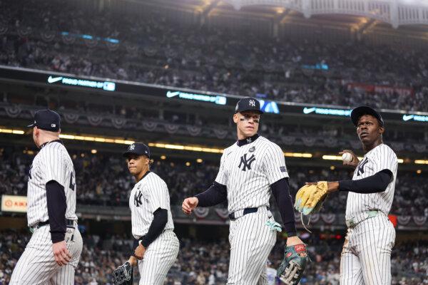 Alex Verdugo #24, Juan Soto #22, Aaron Judge #99 and Jazz Chisholm Jr. #13 of the New York Yankees walk off the field after the end of the third inning during Game Four of the 2024 World Series against the Los Angeles Dodgers at Yankee Stadium in the Bronx borough of New York City on October 29, 2024. (Sarah Stier/Getty Images)