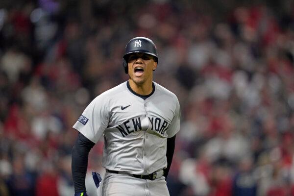 New York Yankees' Juan Soto celebrates after hitting a three-run home run against the Cleveland Guardians during the 10th inning in Game 5 of the baseball AL Championship Series in Cleveland, Ohio, on Oct. 19, 2024. (Godofredo A. Vásquez/AP Photo)