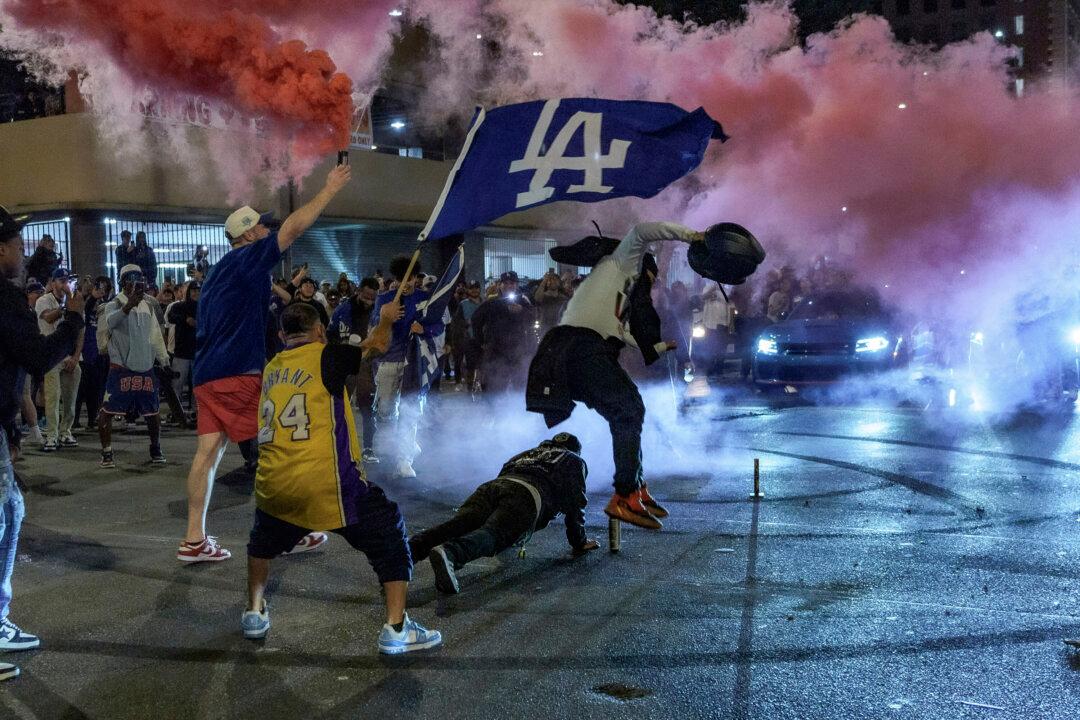 Los Angeles Sees Bus Burned, Store Thefts, and Rowdy Crowds After Dodgers Win World Series