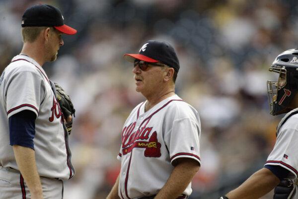 Pitching coach Leo Mazzone #54 of the Atlanta Braves talks strategy with Kent Mercker #50 during the game against the Pittsburgh Pirates at PNC Park in Pittsburgh, Pa., on Aug. 31, 2003. (Craig Melvin/Getty Images)
