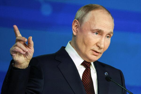 Russian President Vladimir Putin points during a meeting with foreign policy experts at a forum in Sochi, Russia, on Nov. 7, 2024. (Maxim Shipenkov/Pool Photo via AP)