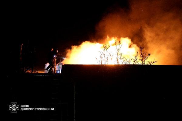 Firefighters work at the site of a Russian missile strike in Dnipro, Ukraine, on Nov. 21, 2024. (Press service of the State Emergency Service of Ukraine in Dnipropetrovsk region/Handout via Reuters)