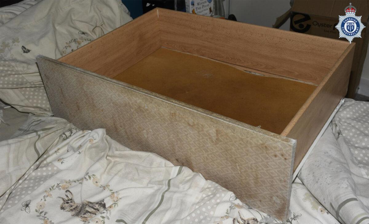 The drawer where a baby was kept in, stored under her mother's bed, until she was discovered weeks before her third birthday, in Cheshire, in an undated photo. (Cheshire Constabulary/PA Wire)