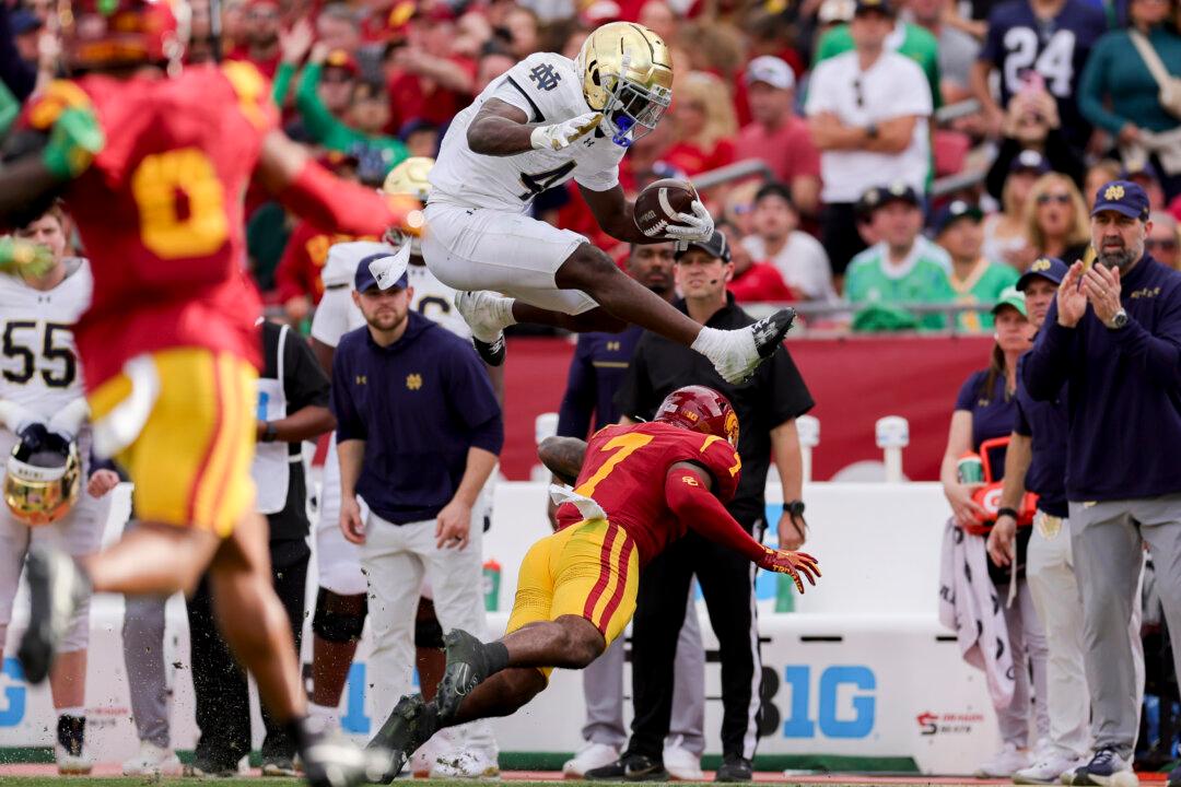 No. 5 Notre Dame Punches CFP Ticket With 2 Late Interception Return TDs to Beat USC 49–35