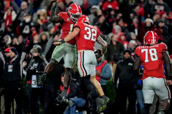 Georgia linebacker Chaz Chambliss (32) celebrates his fumble recovery in overtime of an NCAA college football game against Georgia Tech, in Athens, Ga., on Nov. 30, 2024. (Mike Stewart/AP Photo)