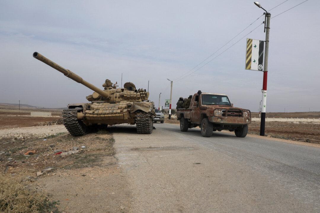 Syrian Rebel Assault Widens as Assad Races to Defend Homs, Damascus