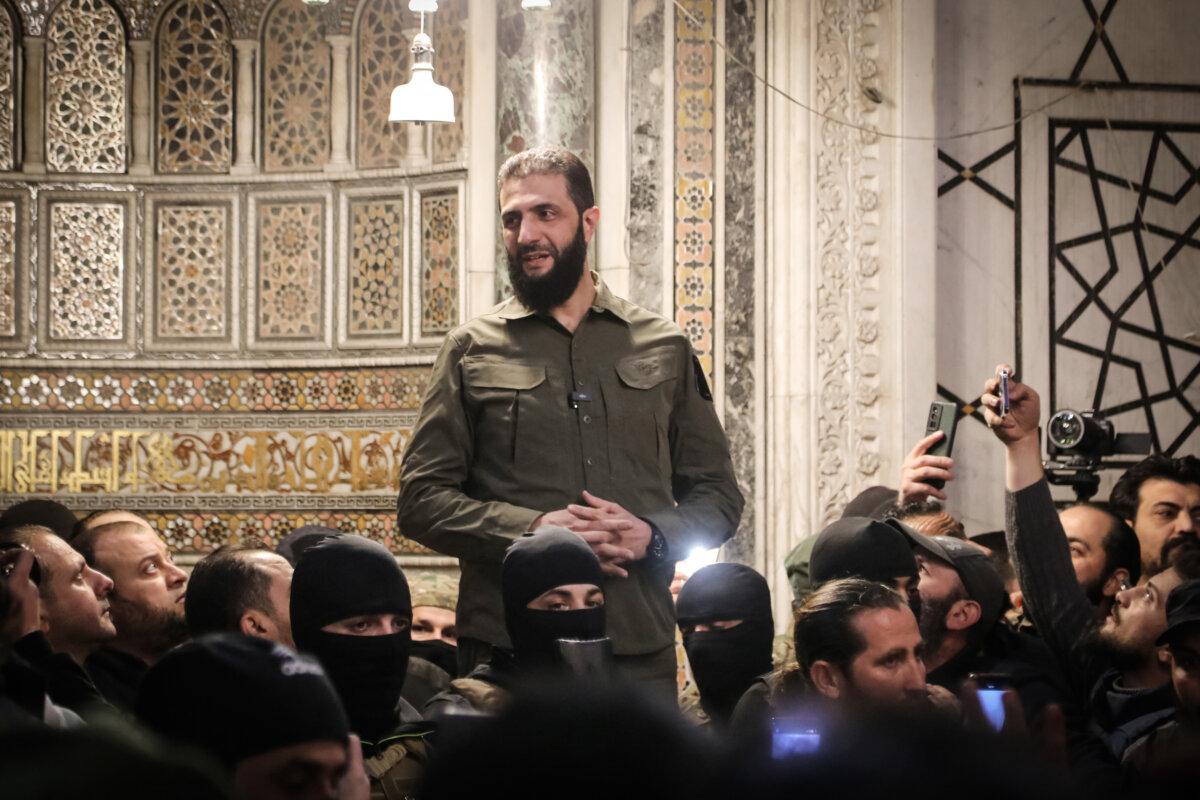 Hayat Tahrir al-Sham leader Abu Mohammed al-Golani addresses a crowd at the Umayyad Mosque in Damascus, Syria, on Dec. 8, 2024. (Abdulaziz Ketaz/AFP via Getty Images)