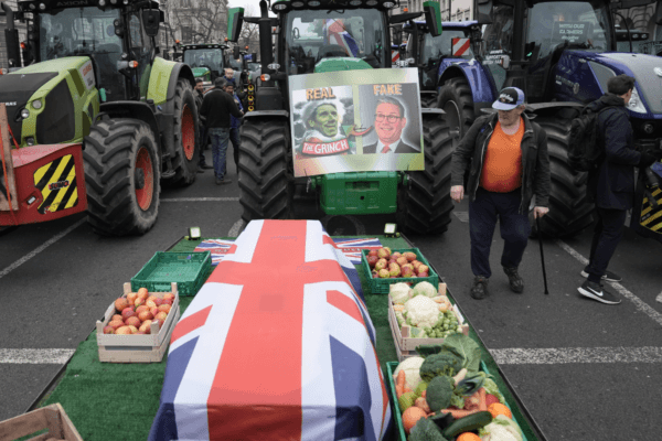 A coffin draped in the Union flag symbolising the death of British farming during a protest by farmers in Westminster over the changes to inheritance tax rules in London, on Dec. 11, 2024. (Stefan Rousseau/PA Wire)