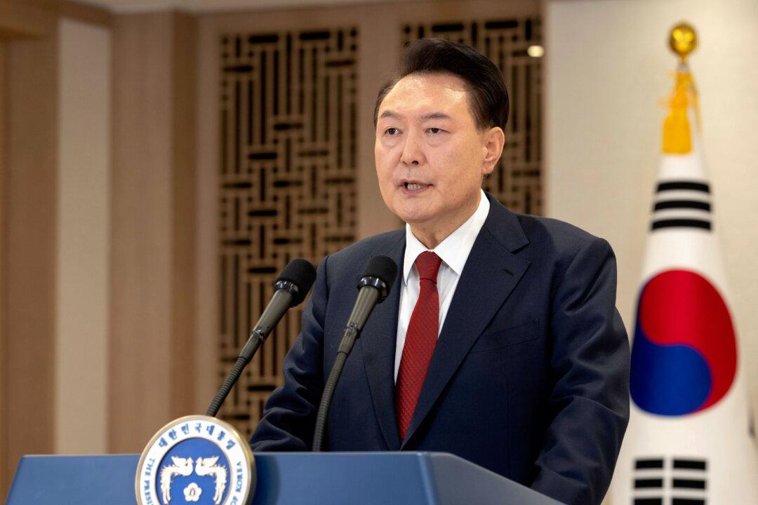 South Korean Authorities Seek Arrest of Suspended President Over Martial Law