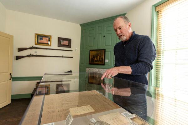 Owner Dan Wheeler talking about the various historical items in the first room of the small museum on the second floor of the newly reopened Man Full of Trouble Tavern in Philadelphia. (Tyger Williams/The Philadelphia Inquirer/TNS)