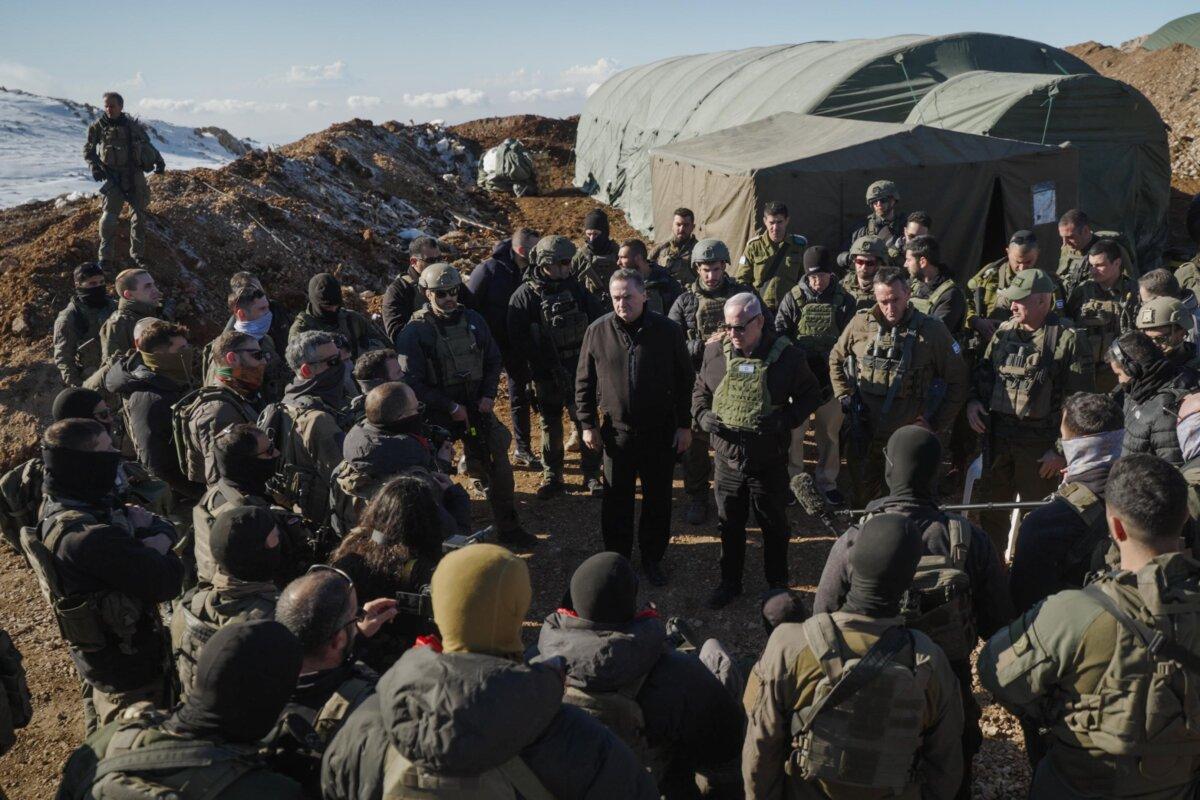 Israeli Prime Minister Benjamin Netanyahu (center) visits IDF troops at the peak of Mount Hermon, a Syrian military position occupied by Israel as the Assad regime fell, on Dec. 17, 2024. (Courtesy of the Prime Minister's Office.)