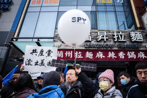 People at a press conference and rally in front of the America ChangLe Association, a now-closed secret Chinese police station, highlighting Beijing's transnational repression, in New York City on Feb. 25, 2023. (Samira Bouaou/The Epoch Times)