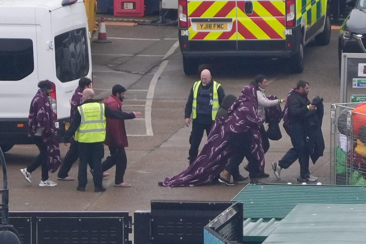A group of people thought to be illegal immigrants are brought in to Dover, Kent, from a Border Force vessel following a small boat incident in the Channel on Dec. 26, 2024. (Gareth Fuller/PA)