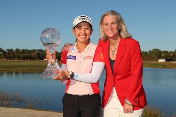 Jeeno Thitikul of Thailand poses with the trophy and LPGA commissioner Mollie Marcoux Samaan after winning the CME Group Tour Championship 2024 at Tiburon Golf Club in Naples, Florida, on Nov. 24, 2024. (Michael Reaves/Getty Images)