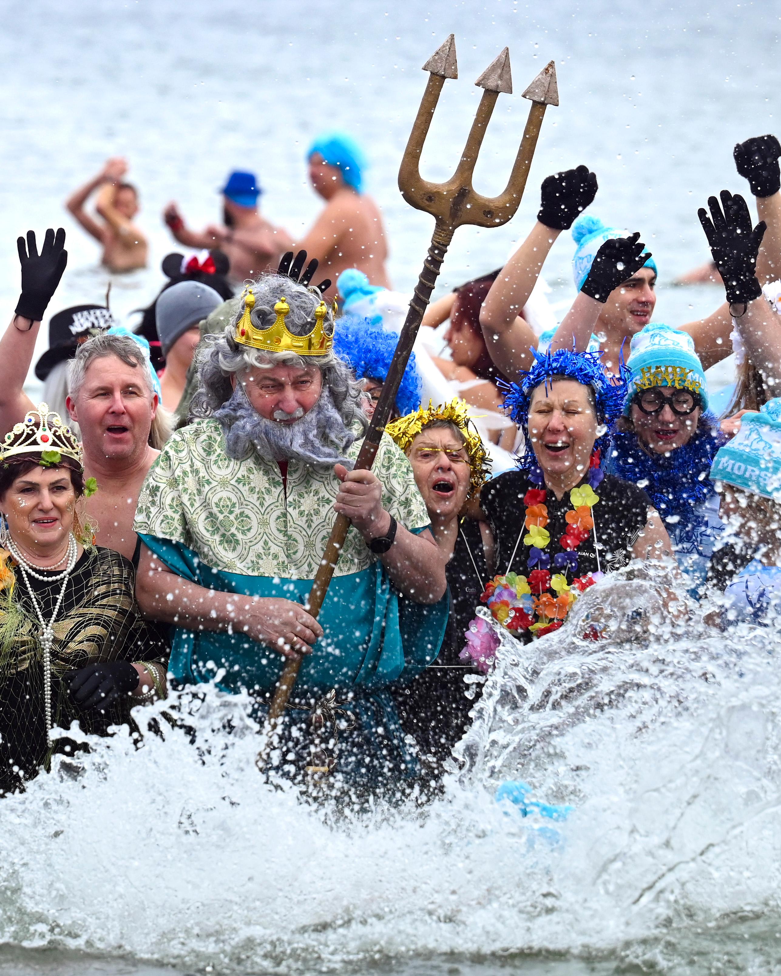 Day in Photos: New Year Swim, Fireworks Attack, and Tar Barrel Festival