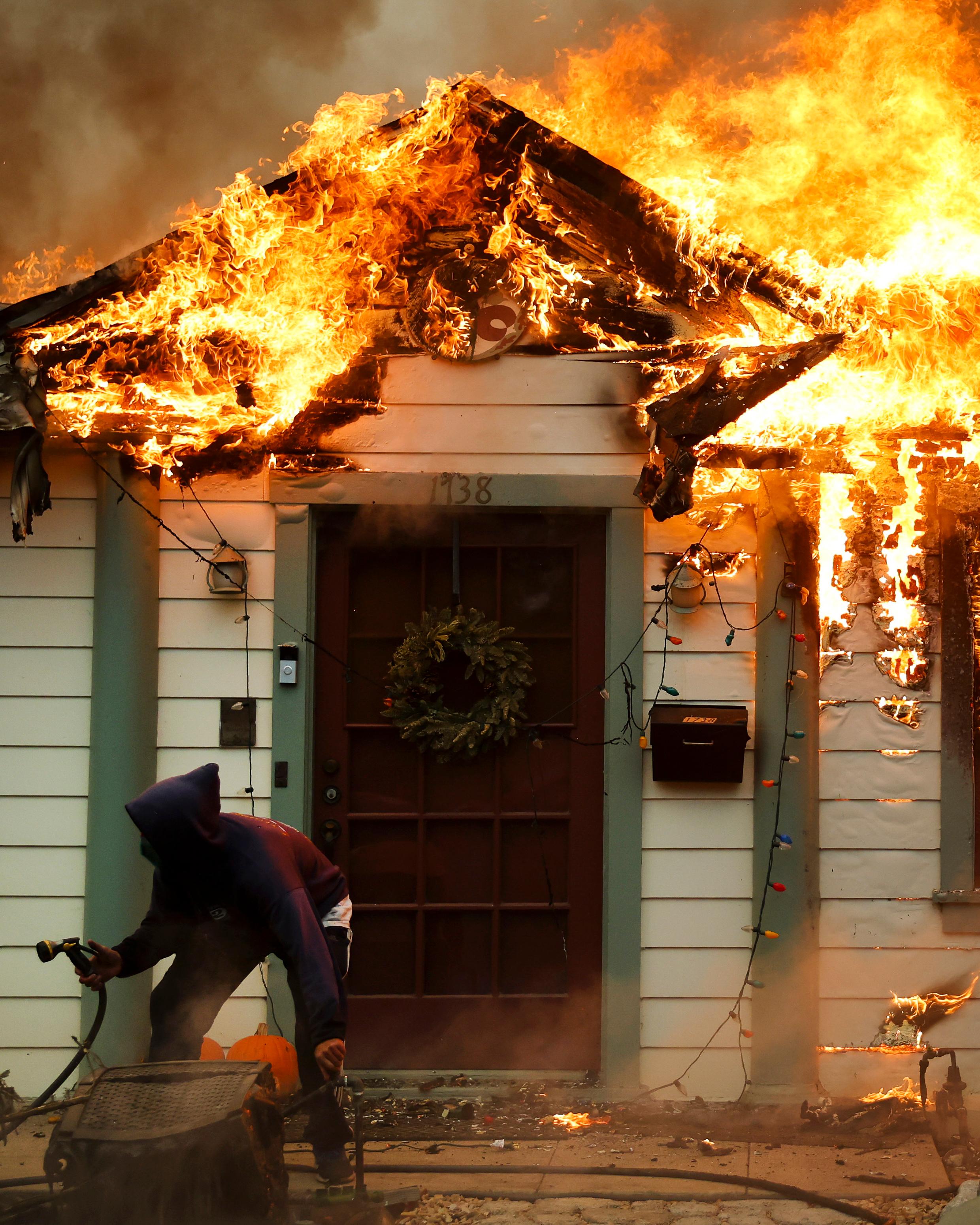 Day in Photos: Fires Near Los Angeles, New Archaeological Discoveries in Egypt, Migrant Gave Birth in a Boat