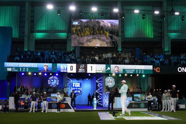 Ludvig Åberg of the Bay Golf Club watches his shot projected on a digital screen during the inaugural match of the TGL Golf League, against the New York Golf Club, in Palm Beach Gardens, Fla., on Jan. 7, 2025. (Rebecca Blackwell/AP Photo)