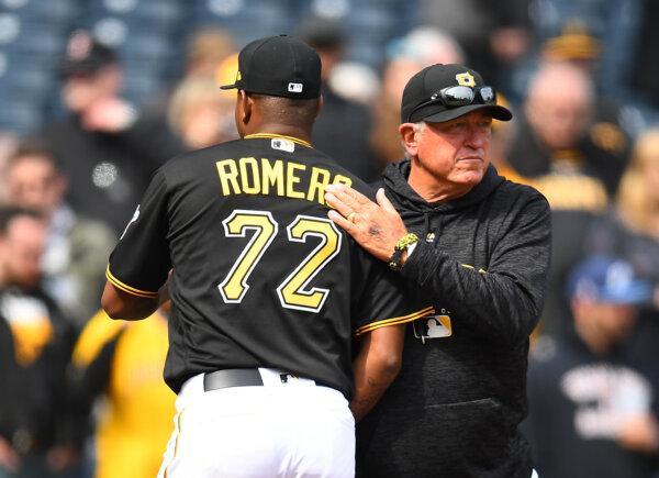 Enny Romero #72 of the Pittsburgh Pirates celebrates with manager Clint Hurdle after a 10–2 win over the Colorado Rockies at PNC Park in Pittsburgh on April 18, 2018. (Joe Sargent/Getty Images)