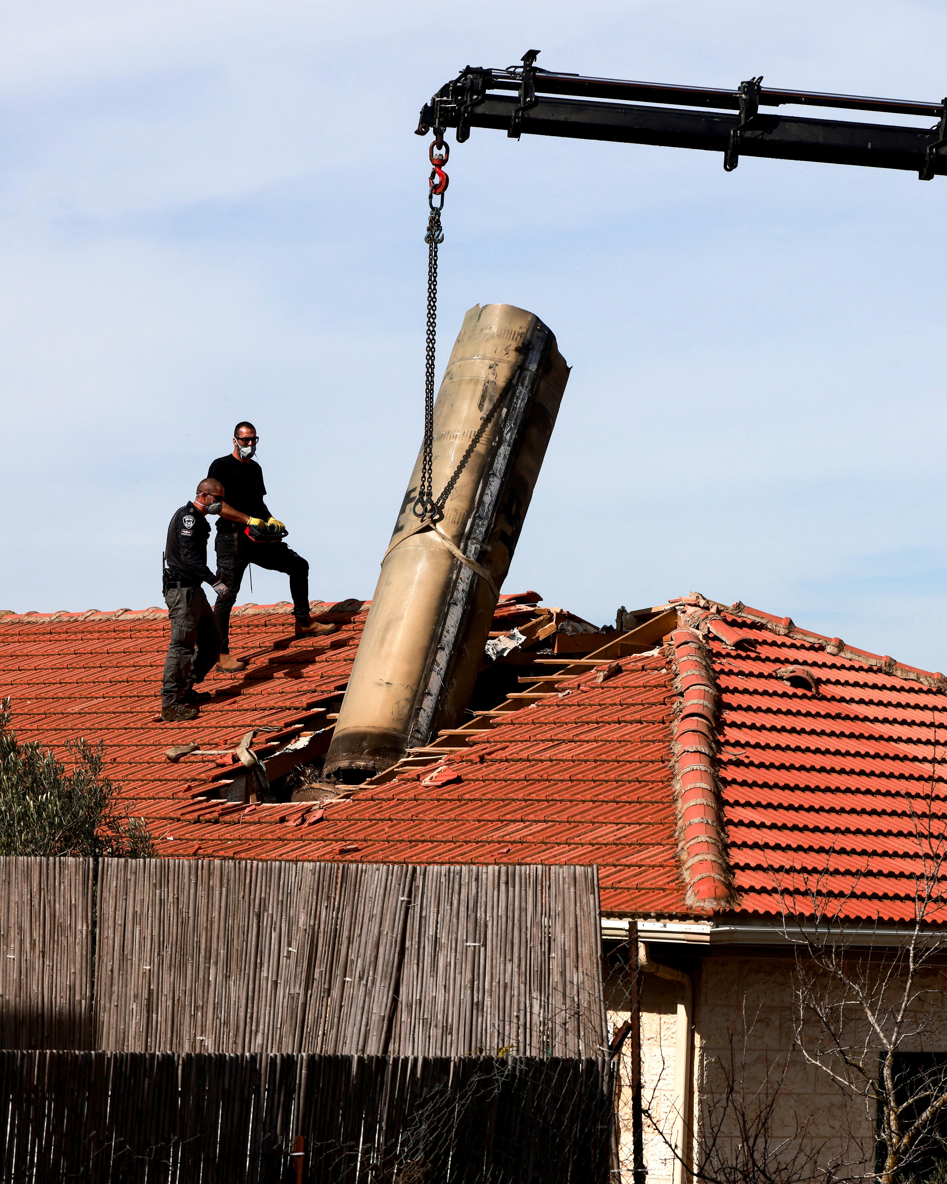 Day in Photos: A Rocket on a Roof in Israel, Hearings on the Secretary of Defense, and Rescuing Illegal Miners