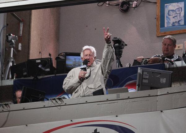 Bob Uecker sings "Take Me Out to the Ballgame" during the 7th inning stretch of a game between the Milwaukee Brewers and the Chicago Cubs, at Wrigley Field in Chicago, Illinois on June 14, 2011. (Jonathan Daniel/Getty Images)