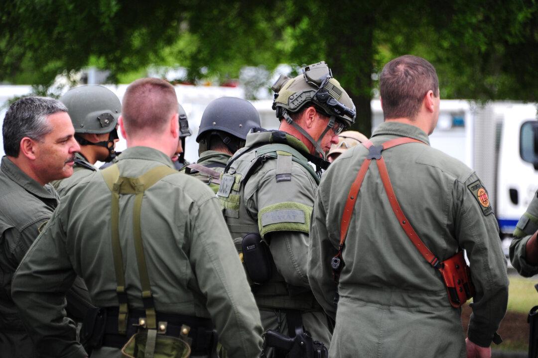 SWAT Shootout in Atlanta Suburb Kills Man and Wounds Officer