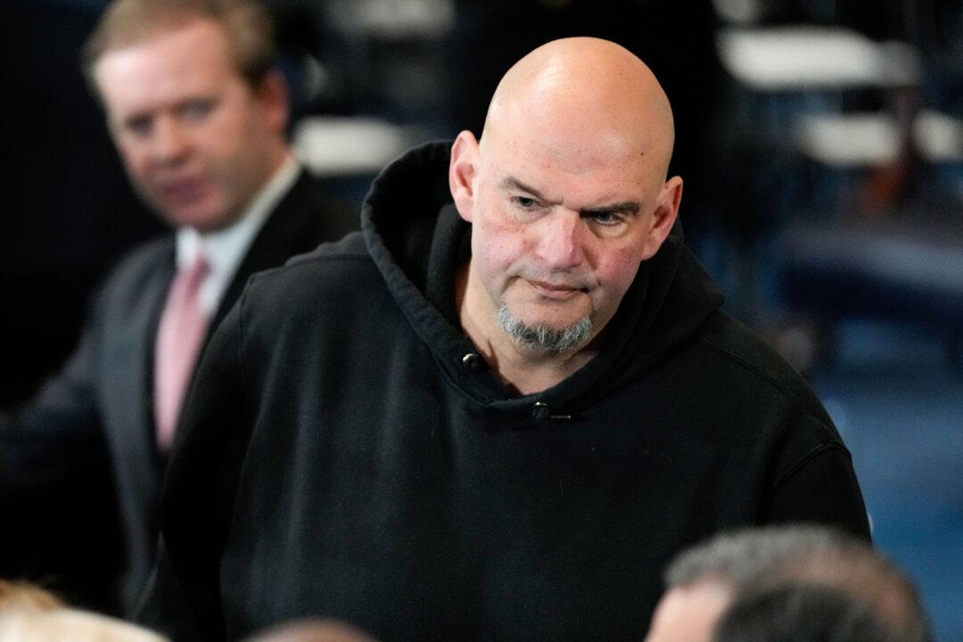 Fetterman Votes With Republicans to Advance Hegseth, Says He Won’t Switch to GOP