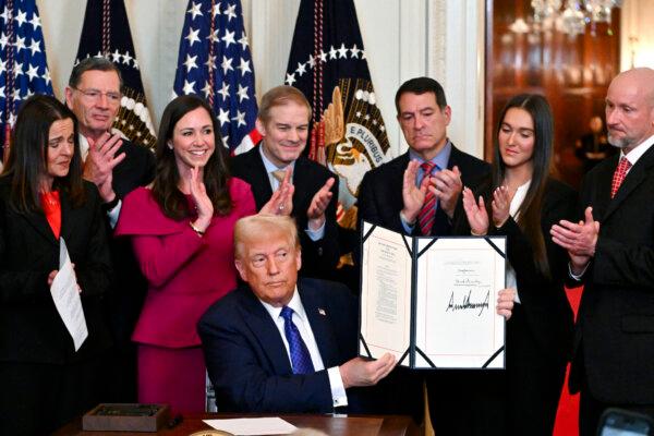 President Donald Trump looks on after signing the Laken Riley Act in the East Room of the White House on Jan. 29, 2025. (Roberto Schmidt/AFP via Getty Images)