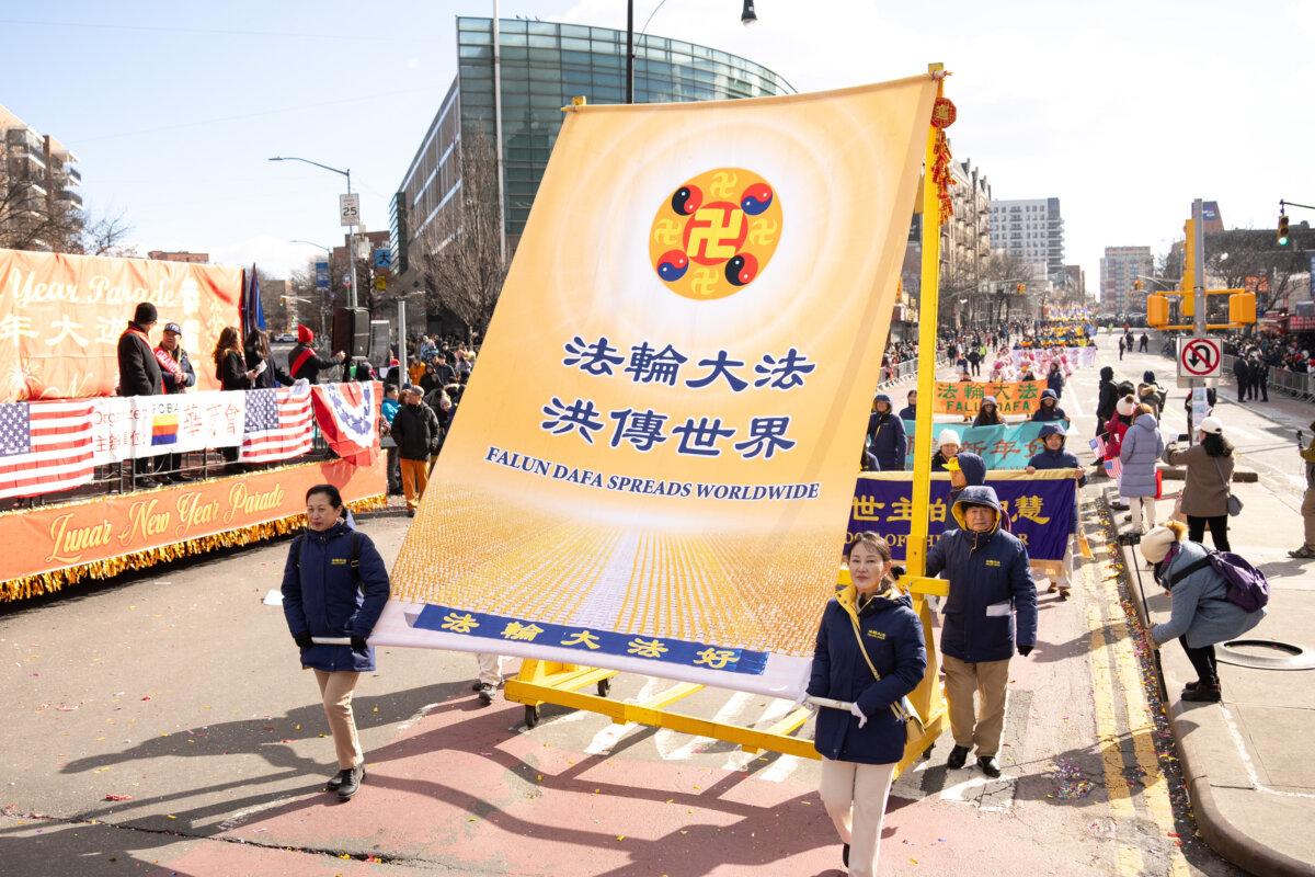 Falun Gong practitioners take part in the parade in the Flushing neighborhood of Queens, N.Y., on Feb. 1, 2025. (Larry Dye/The Epoch Times)
