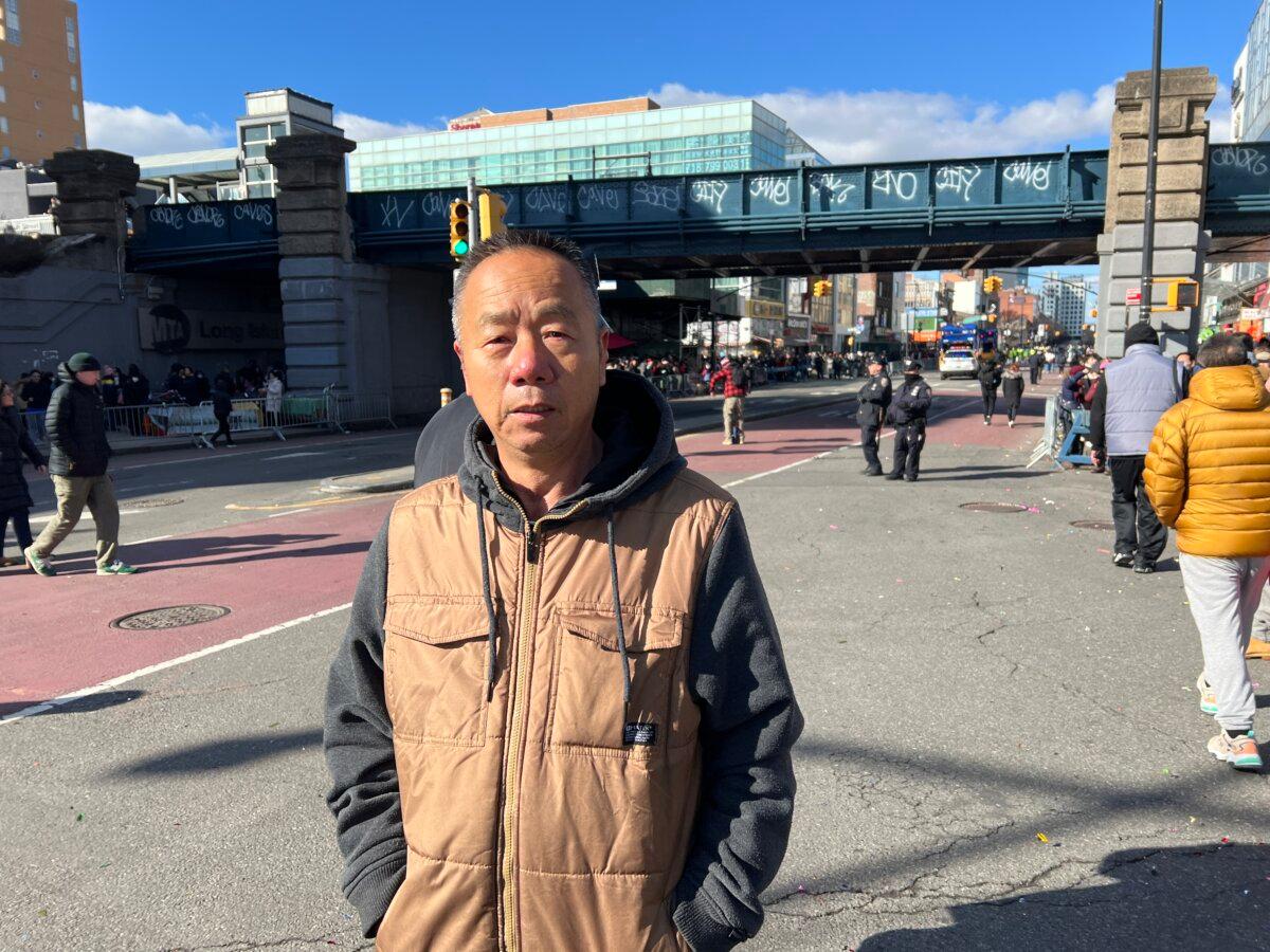 Zhang Ren, a former human rights lawyer in China, comes to see the parade in the Flushing neighborhood of Queens, N.Y., on Feb. 1, 2025. (Shi Ping/The Epoch Times)