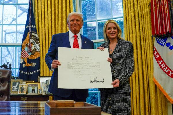 President Donald Trump and U.S. Attorney General Pam Bondi pose for a picture as she's sworn in at the White House in Washington on Feb. 5, 2025. (Kent Nishimura/Reuters)