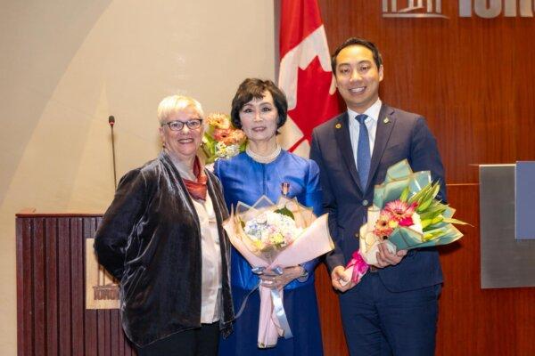 Tia Zhang (C), Shen Yun Performing Arts artist and former National Ballet School instructor, with Canadian MP Kevin Vuong (R) and National Ballet School staff member Deborah Hess at Toronto City Hall on Feb. 13, 2025. Zhang received the King Charles III Coronation Medal. (Xuewen Song)