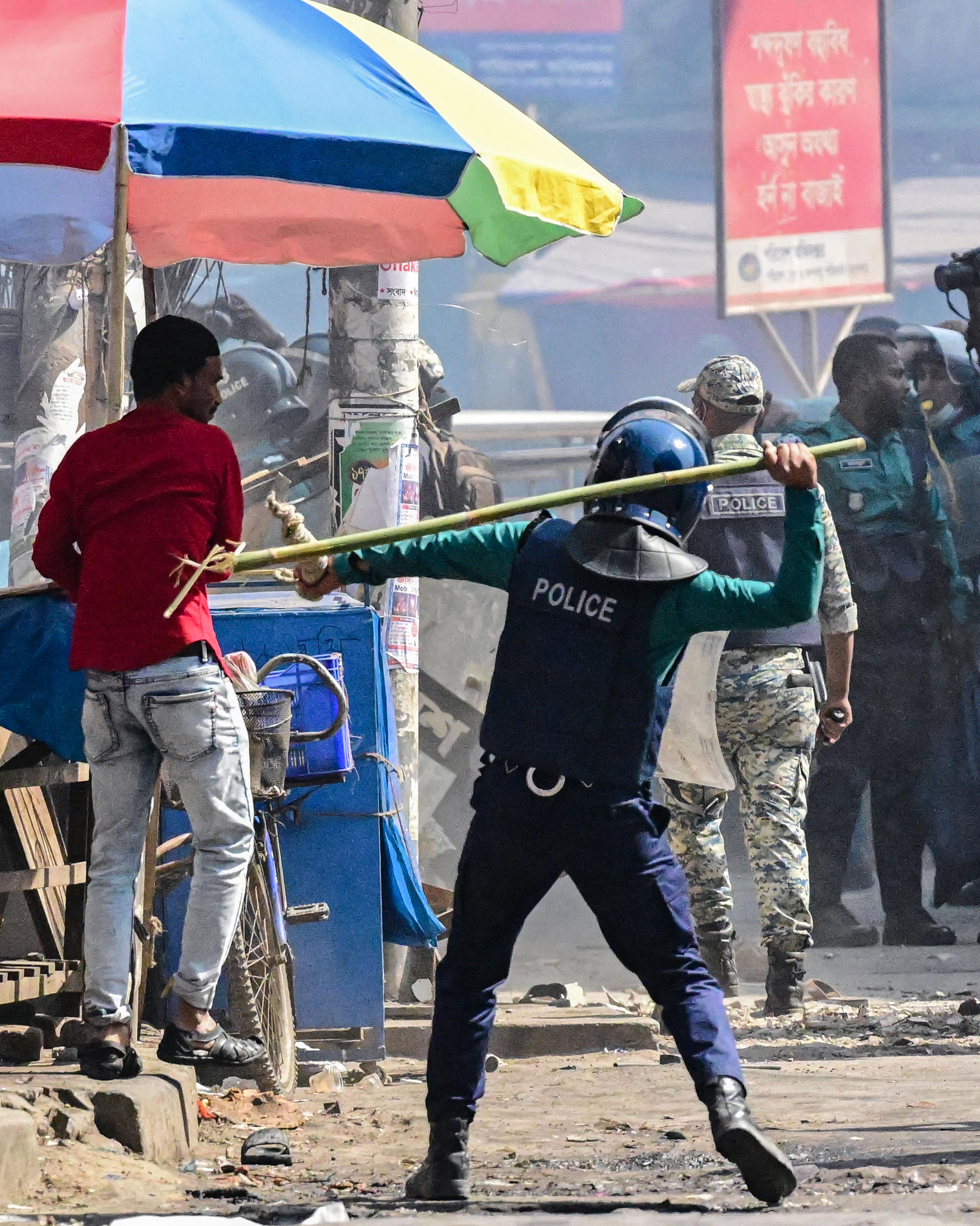 Day in Photos: Police Disperse Rally in Bangladesh, Cyclone in Australia, US Space Force Test Flight Lands
