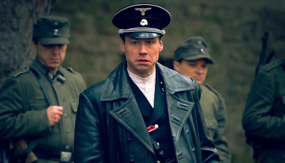SS officer Lange (David Kross), in “The World Will Tremble.” (Vertical)