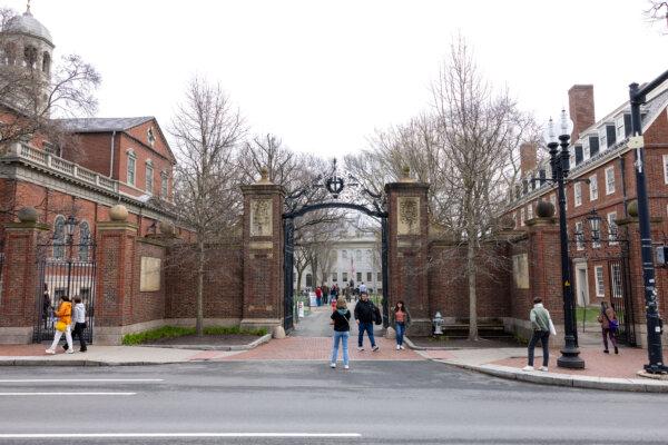 Tourists in front of the main gate to Harvard Yard in Cambridge, Massachusetts on April 15, 2025. (Scott Eisen/Getty Images)