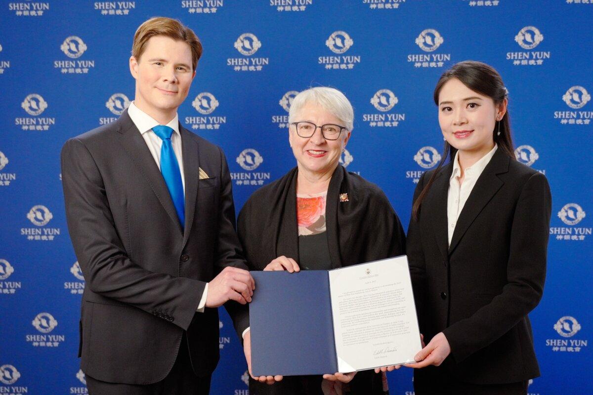 The Lieutenant Governor of Ottawa, Edith Dumont (C), presents Shen Yun Performing Arts with a proclamation at their performance at the National Arts Centre on April 20, 2025. (NTD)