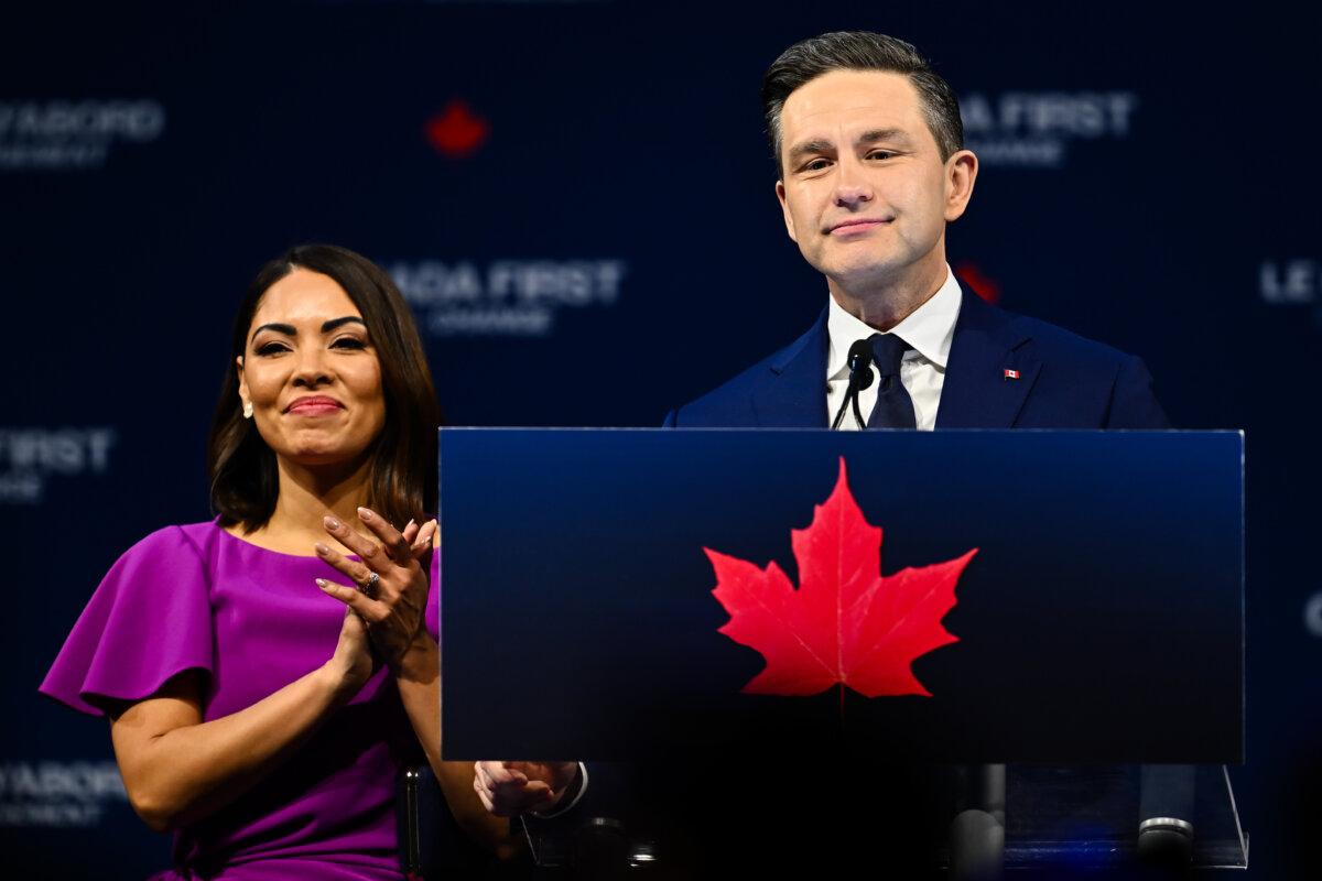Conservative Leader Pierre Poilievre speaks to his supporters alongside his wife, Anaida Poilievre, after losing the federal election, in Ottawa on April 29, 2025. (Minas Panagiotakis/Getty Images)