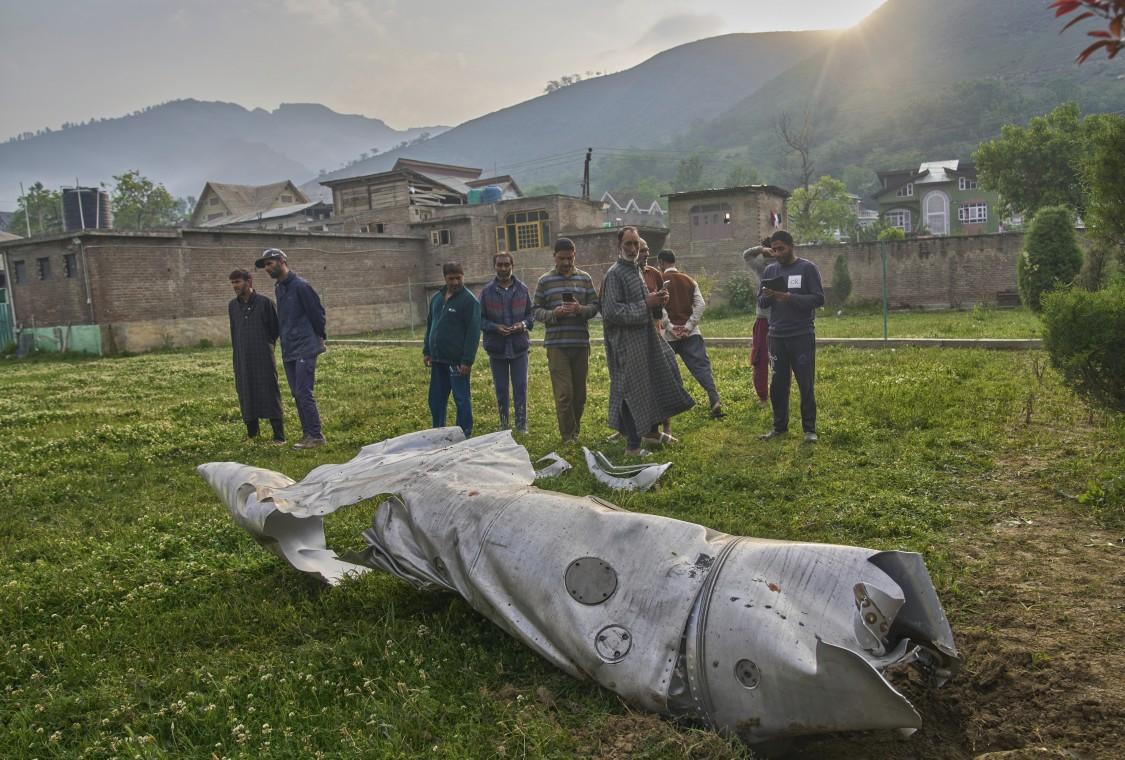 Residents view debris of an aircraft in the compound of a mosque at Pampore in Pulwama district of Indian-administered Kashmir, on May 7, 2025. (Dar Yasin/AP)