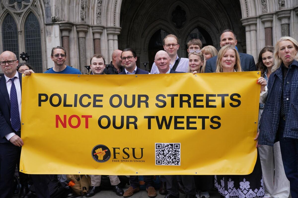 Former Conservative councillor Raymond Connolly (centre) with supporters include broadcaster Dan Wootton outside the Court of Appeal at the Royal Courts of Justice in central London on May 15, 2025. (Yui Mok/PA)