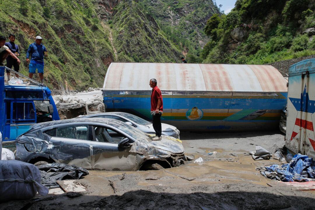 Search Continues for 19 Missing After Flooding in Nepal