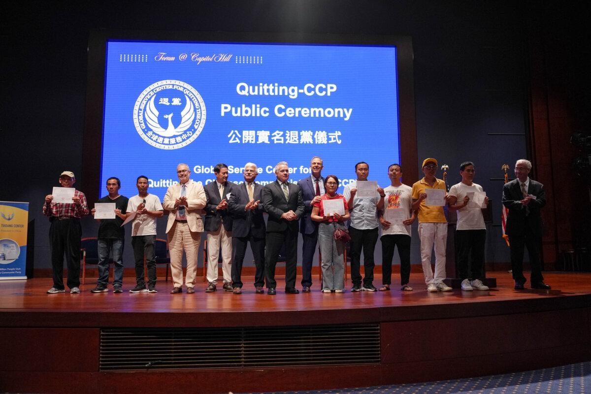 (L–R) Piero Tozzi, senior policy adviser to Rep. Chris Smith (R-N.J.), Rep. Scott Perry (R-Pa.), Robert Destro, former assistant secretary of state for democracy, human rights, and labor, and Smith stand together with people who receive certificates for quitting the Chinese Communist Party-affiliated organizations, in Washington, on July 17, 2025. (Samira Bouaou/The Epoch Times)