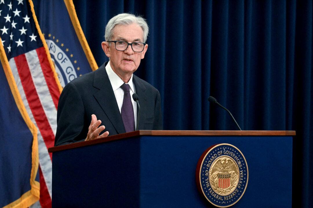 Fed Cuts Rates by Quarter Point