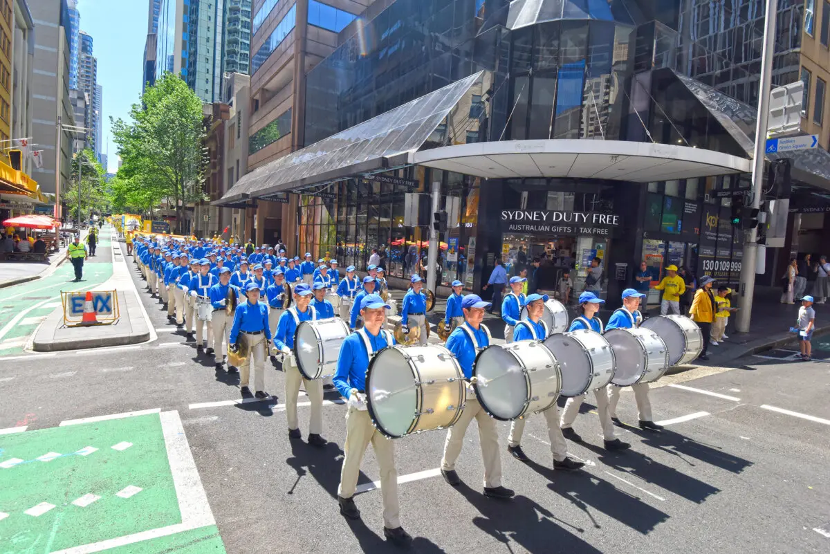 Falun Dafa practitioners take part in a "Celestial Band" performance as part of a parade in Sydney's CBD in Australia, on Oct. 10, 2025. (Nick Shen/The Epoch Times)